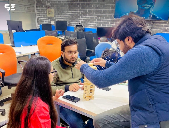 Team playing Jenga game